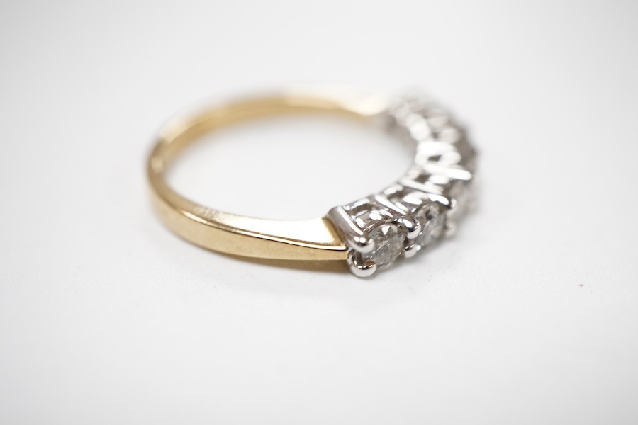 A seven-stone diamond ring, set with seven brilliant-cut diamonds totalling approximately 0.50 carats, mounted in 9ct gold, size N, British hallmarks, gross weight approximately 3 grams